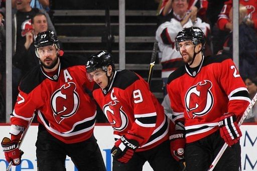 New Jersey Devils' Zach Parise (C) scored twice in the third period